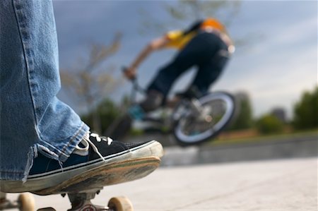 skate board park - Skateboarder Watching Cyclist on Ramp Stock Photo - Rights-Managed, Code: 700-00546682