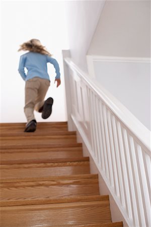 run stair - Girl Running Up Staircase Stock Photo - Rights-Managed, Code: 700-00547176