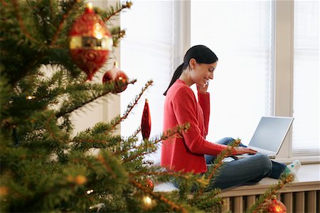 Woman Using Laptop and Cellphone Stock Photo - Rights-Managed, Code: 700-00547265