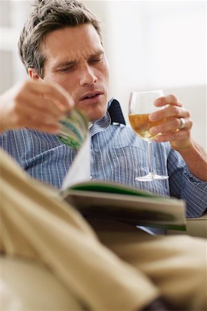 Man Drinking Wine and Reading Stock Photo - Rights-Managed, Code: 700-00549311