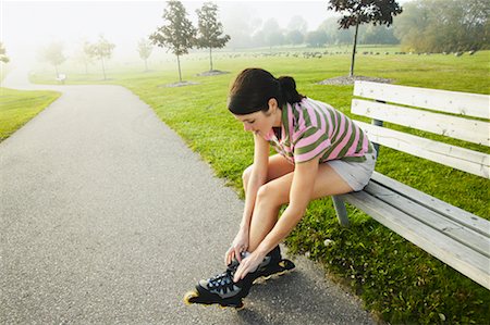 simsearch:400-04609585,k - Woman Tying In-Line Skates Stock Photo - Rights-Managed, Code: 700-00549458