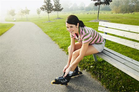 simsearch:400-04609585,k - Woman Tying In-Line Skates Stock Photo - Rights-Managed, Code: 700-00549459