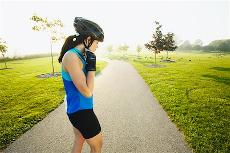 simsearch:400-04609585,k - Woman Buckling Helmet Stock Photo - Rights-Managed, Code: 700-00549469