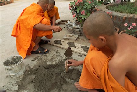 Buddhist Monks Making Roof Ornaments, Wat Choum Khong, Luang Prabang, Laos Stock Photo - Rights-Managed, Code: 700-00549489