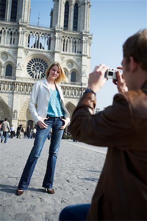 Man Photographing Woman in Front Of Notre Dame Cathedral, Paris, France Stock Photo - Rights-Managed, Code: 700-00549674