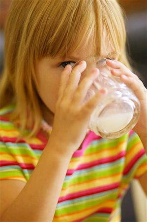 Girl Drinking Milk Stock Photo - Rights-Managed, Code: 700-00549706