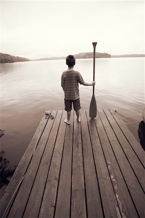Boy Standing on Dock Stock Photo - Rights-Managed, Code: 700-00549732