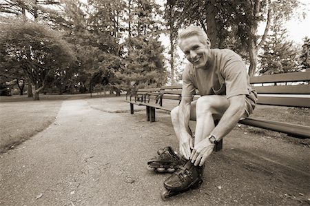 simsearch:700-00529740,k - Man Putting on Roller Blades Stock Photo - Rights-Managed, Code: 700-00549915