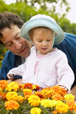 simsearch:700-00549968,k - Father and Daughter Looking at Flowers Fotografie stock - Rights-Managed, Codice: 700-00549951