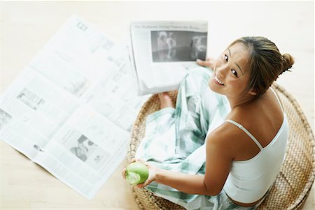 simsearch:700-00062758,k - Woman Reading Newspaper and Eating Apple Stock Photo - Rights-Managed, Code: 700-00554045