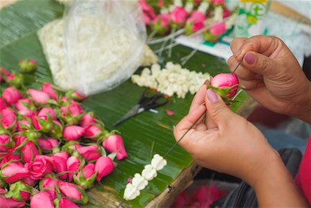 Close Up of Woman Weaving Flowers, Bangkok, Thailand Stock Photo - Rights-Managed, Code: 700-00554333