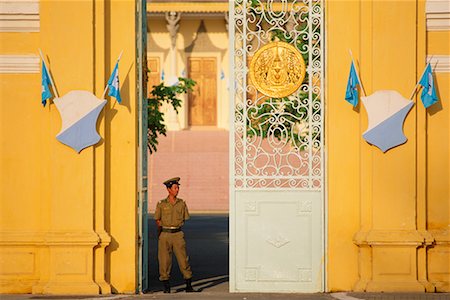 Guard at Gate, Phnom Penh, Cambodia Stock Photo - Rights-Managed, Code: 700-00554405