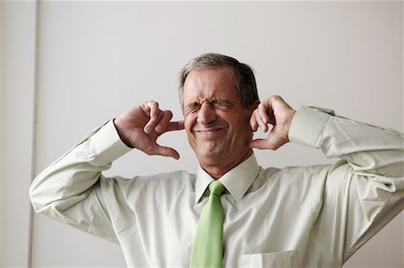 plugging ears - Businessman Plugging Ears Stock Photo - Rights-Managed, Code: 700-00554686