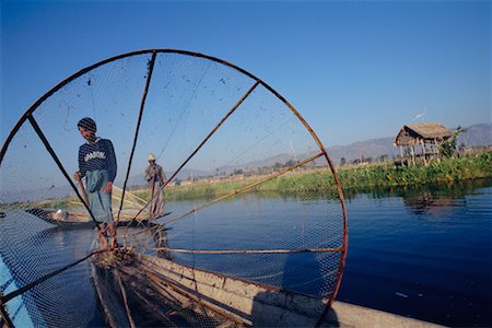 Man on Boat, Inle Lake, Myanmar Foto de stock - Direito Controlado, Número: 700-00554854