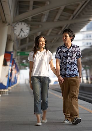 Couple Walking on Train Platform, Bangkok, Thailand Stock Photo - Rights-Managed, Code: 700-00555114