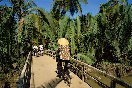 People Riding Bicycles Across Bridge, My Tho, Vietnam Stock Photo - Rights-Managed, Code: 700-00555634
