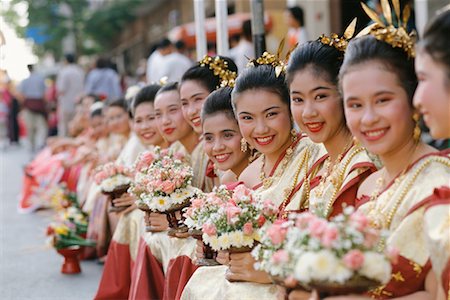 Row of Women Holding Flowers, Chiang Mai, Thailand Stock Photo - Rights-Managed, Code: 700-00555735