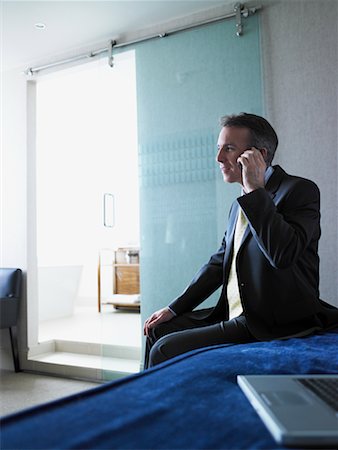 simsearch:700-00159009,k - Businessman Using Cellular Phone In Hotel Room Stock Photo - Rights-Managed, Code: 700-00555818