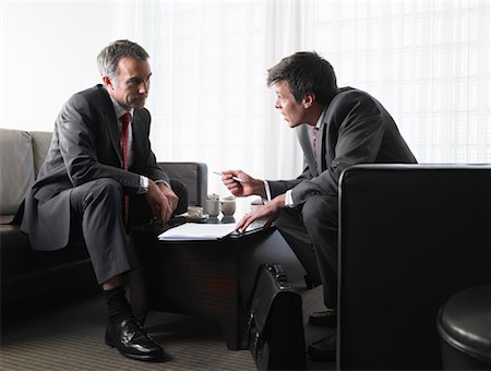 serious counselor talking with person - Businessmen with Contract Stock Photo - Rights-Managed, Code: 700-00555827