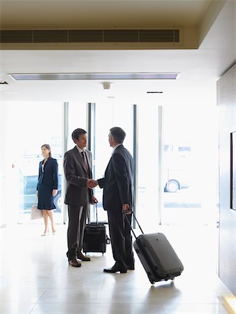 suitcase walking away - Business People in Hotel Foyer Stock Photo - Rights-Managed, Code: 700-00555844