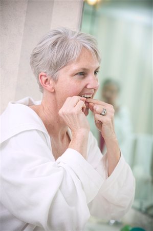 simsearch:640-01358246,k - Woman Flossing Teeth Stock Photo - Rights-Managed, Code: 700-00555986