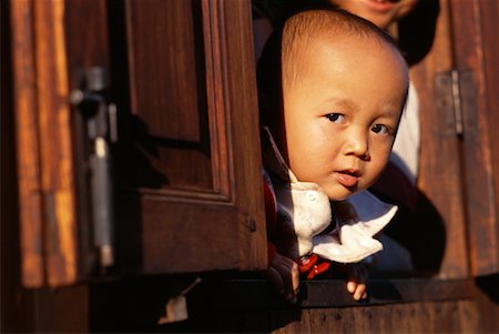 Portrait of Child in Window, Inle Lake, Myanmar Stock Photo - Rights-Managed, Code: 700-00556031