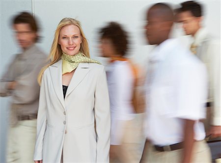 Portrait of Businesswoman with Blurred Business People Stock Photo - Rights-Managed, Code: 700-00556399
