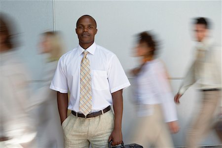 south africa and black and business - Portrait of Businessman with Blurred Business People Foto de stock - Con derechos protegidos, Código: 700-00556401
