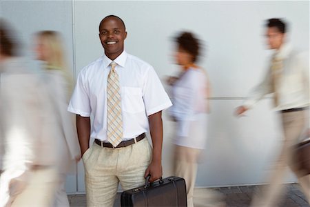 south africa and black and business - Portrait of Businessman with Blurred Business People Stock Photo - Rights-Managed, Code: 700-00556402