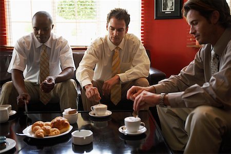 south africa and black and business - Businessmen Having Coffee in Cafe Foto de stock - Con derechos protegidos, Código: 700-00556565