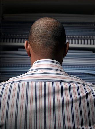 stacked dress shirts - Man in Fabric Shop Stock Photo - Rights-Managed, Code: 700-00557186