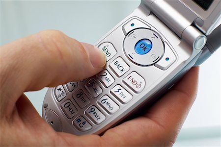 Hand Using Cellular Phone Stock Photo - Rights-Managed, Code: 700-00557228