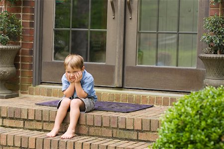 Boy Sitting on Steps Stock Photo - Rights-Managed, Code: 700-00557521