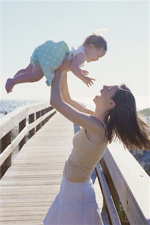 Mother Lifting Child at Beach Stock Photo - Rights-Managed, Code: 700-00557592