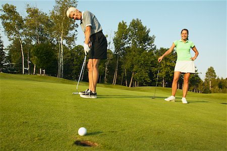 picture of mom and daughter playing golf - Mother and Daughter Golfing Stock Photo - Rights-Managed, Code: 700-00550096