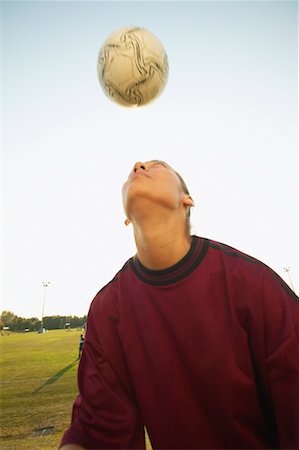 Girl Hitting Soccer Ball Stock Photo - Rights-Managed, Code: 700-00550131