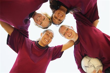 sports team huddle - Soccer Team Huddling Foto de stock - Con derechos protegidos, Código: 700-00550133