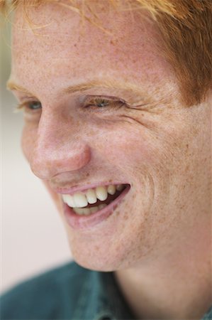 face close up young man looking sideways - Portrait of Young Man Stock Photo - Rights-Managed, Code: 700-00550195