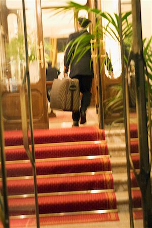 Bellhop Carrying Luggage Stock Photo - Rights-Managed, Code: 700-00550648