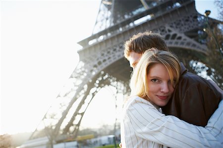 eiffel tower at day with people standing - Couple by Eiffel Tower, Paris, France Stock Photo - Rights-Managed, Code: 700-00550730