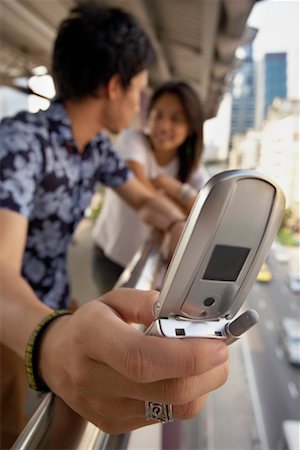 subway platform outside - Couple with Cell Phone Stock Photo - Rights-Managed, Code: 700-00551555