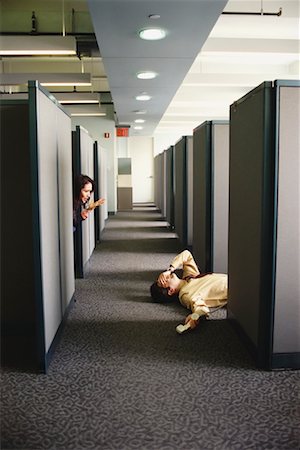 Man Passed Out on Office Floor Fotografie stock - Rights-Managed, Codice: 700-00551671