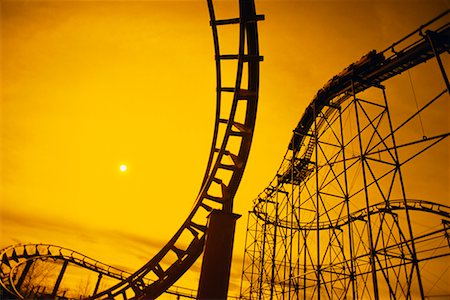 railway tracks in silhouette - Roller Coaster at Sunset Stock Photo - Rights-Managed, Code: 700-00552131