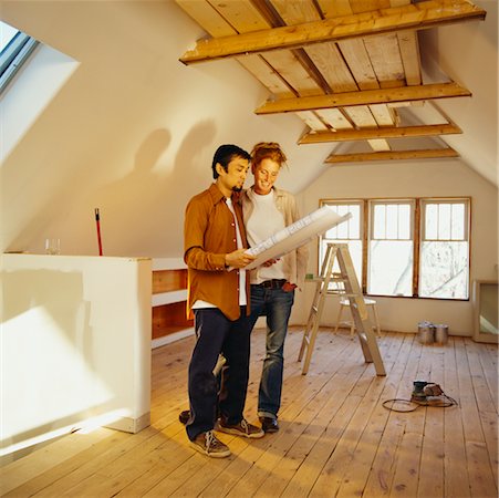 simsearch:700-01260521,k - Portrait of Couple Looking at Floor Plans Fotografie stock - Rights-Managed, Codice: 700-00552272