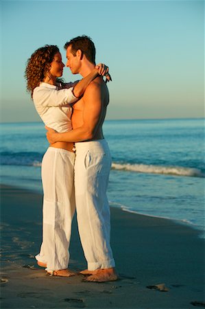 simsearch:700-00606551,k - Couple Embracing at Beach Stock Photo - Rights-Managed, Code: 700-00552352