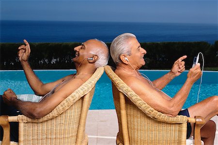 Two Men Listening to Music Foto de stock - Con derechos protegidos, Código: 700-00552887