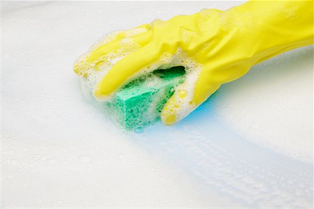 sponge with suds - Rubber Gloved Hand Scrubbing with Sponge Stock Photo - Rights-Managed, Code: 700-00553850