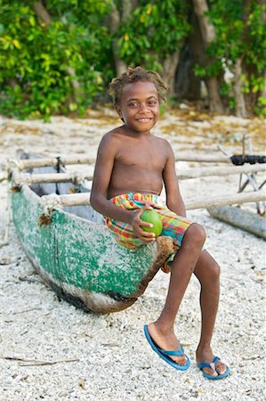 Girl With A Mango On The Beach, White Grass Ocean Resort, Tanna, Vanuatu Fotografie stock - Rights-Managed, Codice: 700-00553995