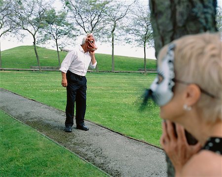 Couple in Park Wearing Masks Stock Photo - Rights-Managed, Code: 700-00560537