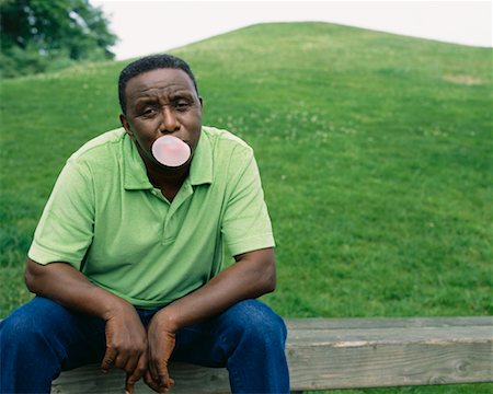Portrait of Man Blowing Bubble Gum Stock Photo - Rights-Managed, Code: 700-00560531